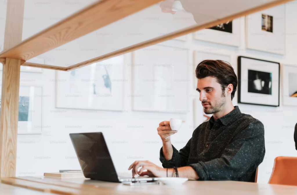 A man is working on his computer